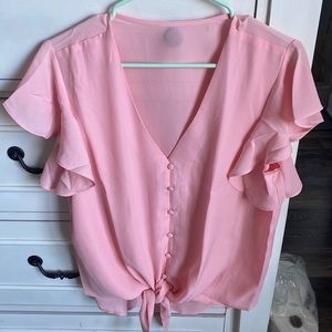 Pink blouse with flutter sleeves